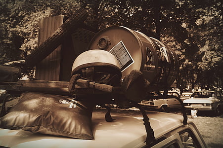roof rack, lumber, antiques, helmet motorcycle, barrel, first aid kit, a barrel of oil