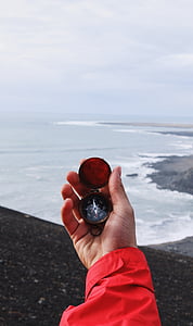 person, using, compass, heading, south, ocean, west beach