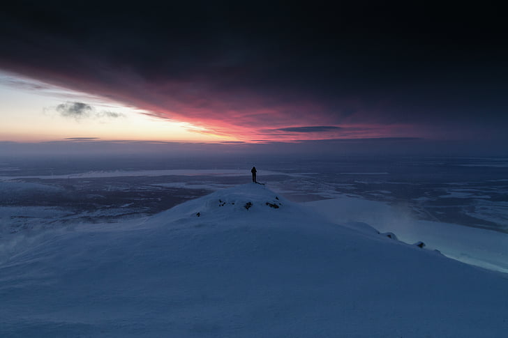 person, standing, snow, covered, hill, near, sea