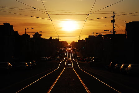 cars, silhouette, street, sunrise, sunset, tramlines, transportation
