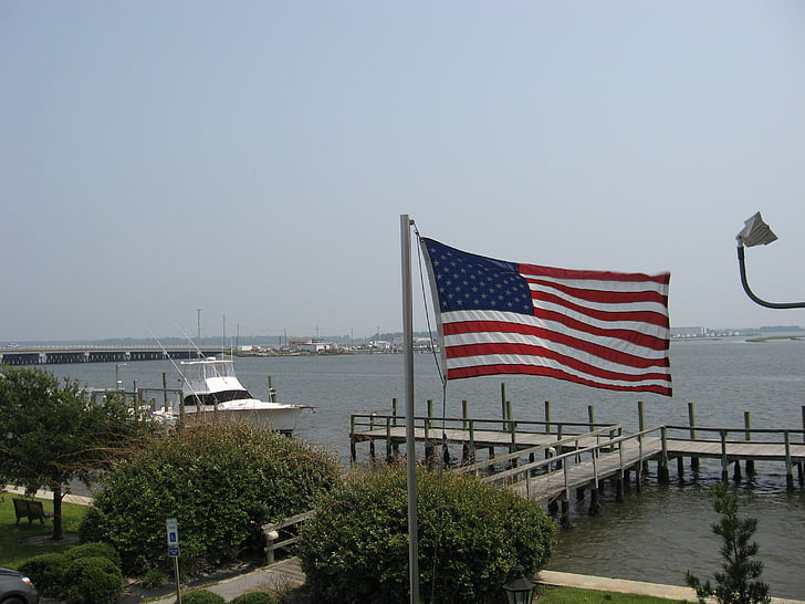 flag, docks, boats