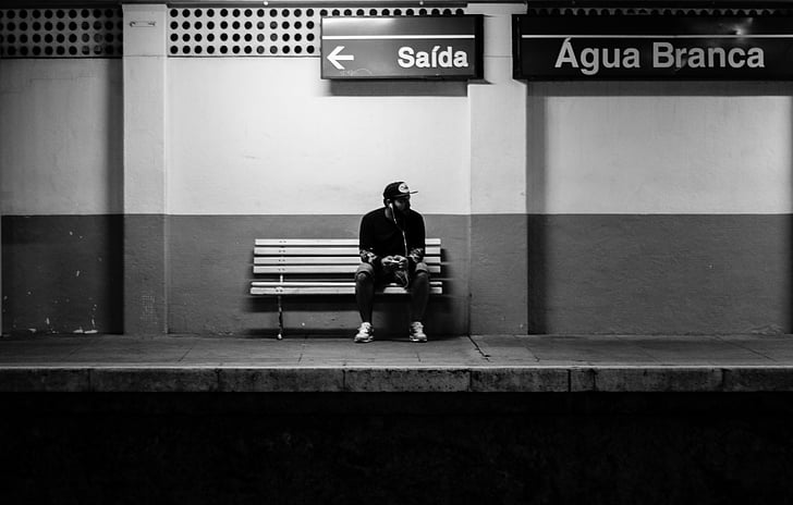 adult, alone, bench, black and-white, destination, indoors, light