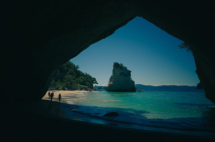 beach, cave, ocean, people, sand, sea, shore