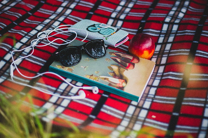 apple, book, mobile phone, outdoors, smartphone, sunglasses