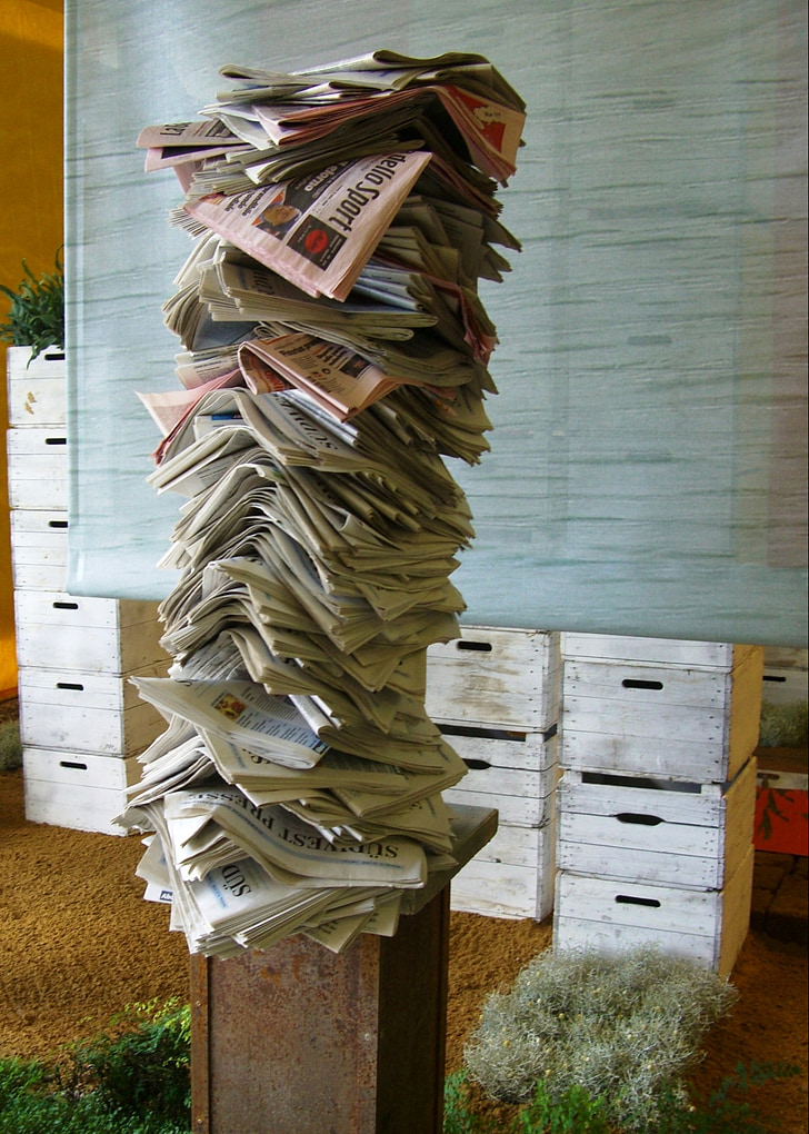 newspaper, paper stack, stele, rusty, art