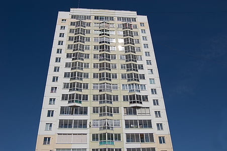 building, multistory building, high-rise, against the blue sky, blue sky, sunny day, dark blue sky