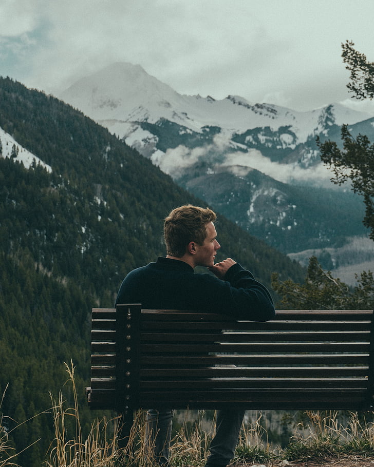 bench, man, mountains, overcast, person, sky, snow