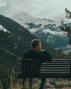 bench, man, mountains, overcast, person, sky, snow