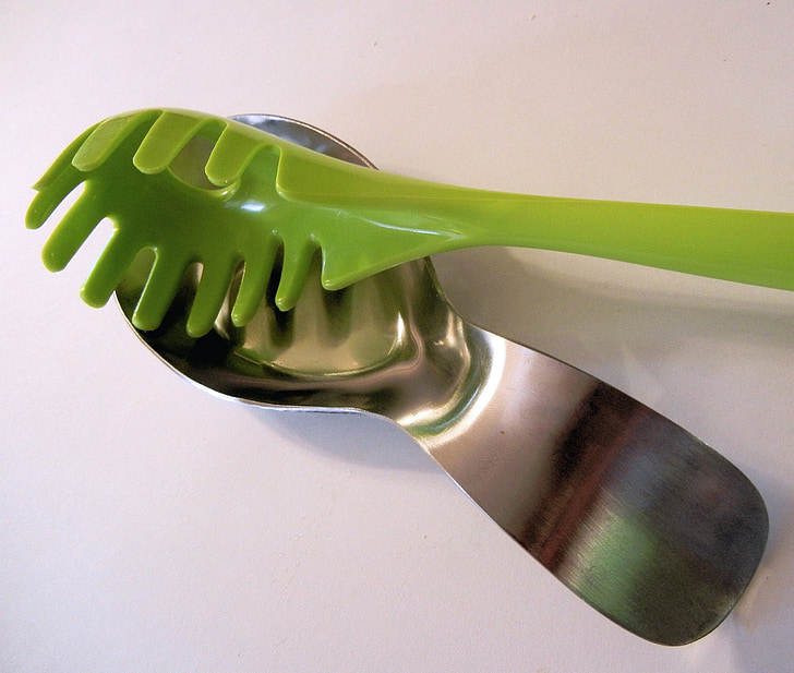 stainless spoon rest, green plastic utensil, spaghetti spoon