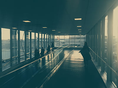 person, wearing, black, jacket, concrete, flooring, airport