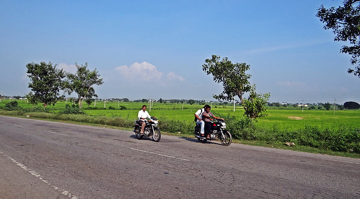 highway, paddy field, bike rider, gangavati, karnataka, india