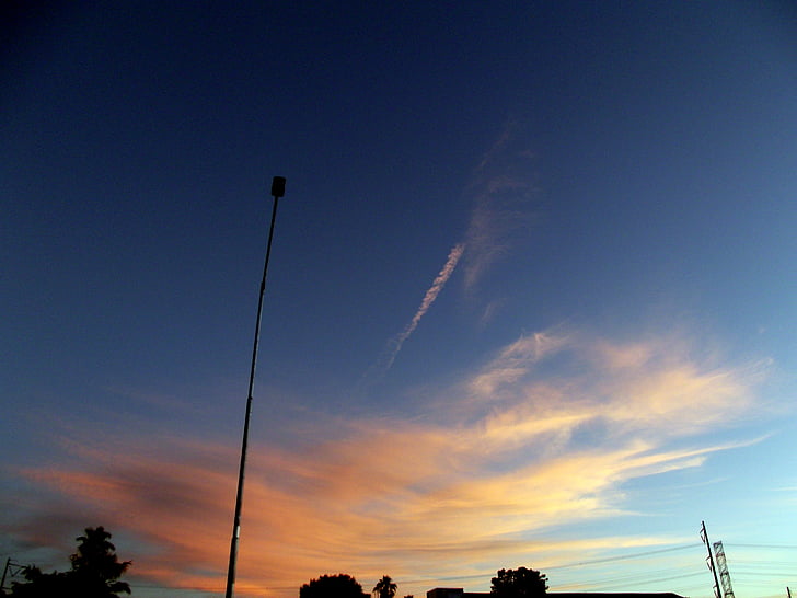 sunset, glow, orange, sky, clouds, streetlight, pole