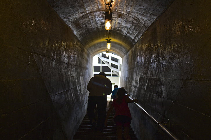 two, persons, beige, concrete, tunnel, light, lightbulb