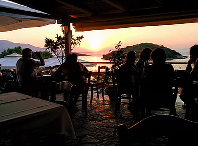 beach, café, chairs, men, ocean, people, restaurant