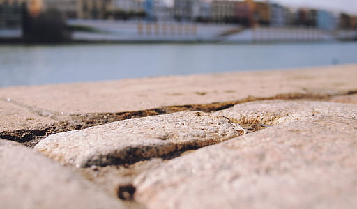 brown, concrete, pavement, ground, water, day, outdoors
