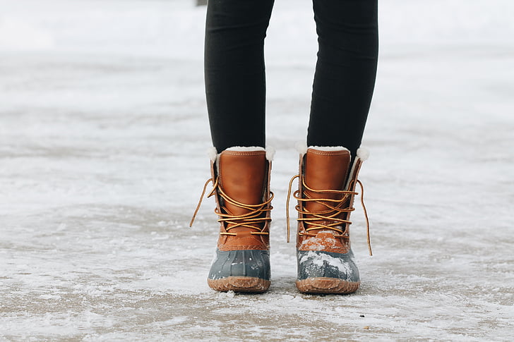 person, wearing, black, brown, duck, boots, snowy