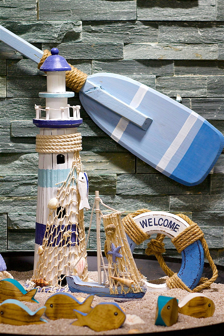 lighthouse, lifebelt, paddle, fish, sand