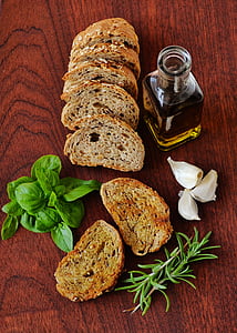 bottle, bread, food, garlic, olive oil, rosemary, table