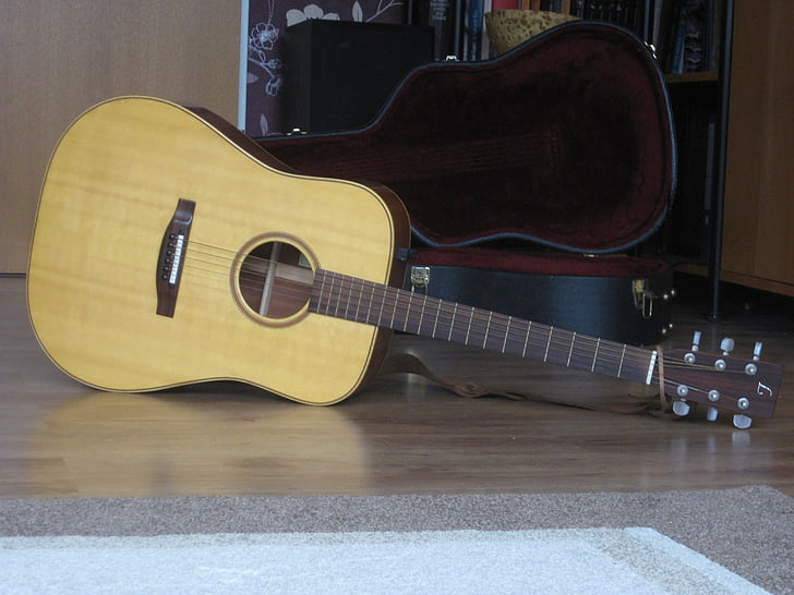 acoustic guitar, guitar, music, musical instrument, indoors, musical instrument string, arts culture and entertainment