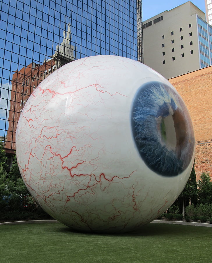 giant eyeball, enormous orb, downtown, sculpture, eyeball, huge, staring