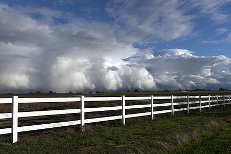 rain clouds, white fence, pasture, farm, rural, sky, grass