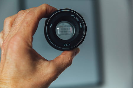 person, holding, black, camera, lens, hand, blur