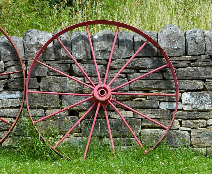 wagon wheel, wheel, old, red, leaning, wall, stone