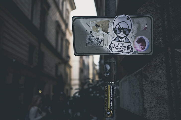 buildings, city, outdoors, sign, stickers, urban, street