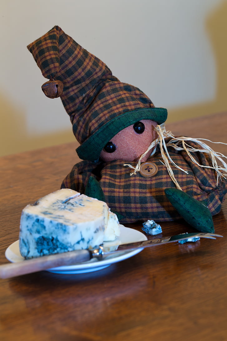 stuffed toy, mouse, slumped, bell cap, check suit, gorgonzola cheese, cheese knife