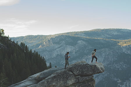 two, person, standing, mountain, cliff, daytime, hiking