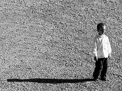 black and white, kid, child, boy, portrait, gravel, shadow