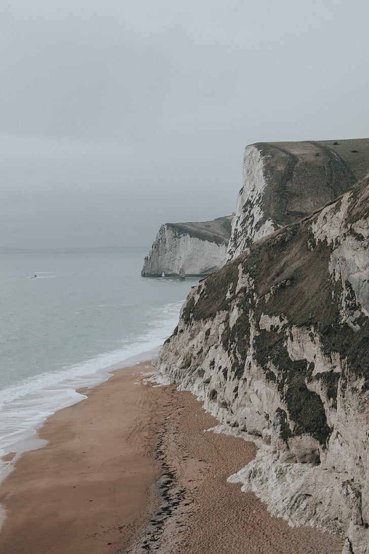 brown, white, concrete, cliff, near, beach, grey