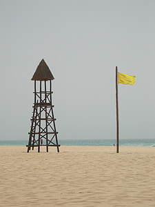 yellow flag, warning, sandy beach, wind, windy, watchtower, sand