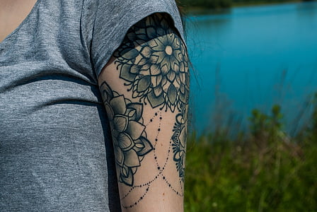 tattoo, mandala, the hand, one person, midsection, water, day