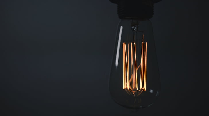 close-up, electricity, light, black background, light bulb, lighting equipment, illuminated