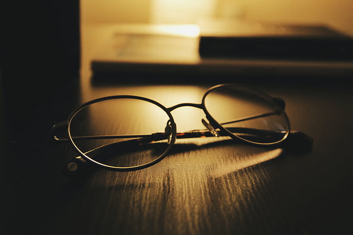 eyeglasses, eyewear, table, dark, room, office, light