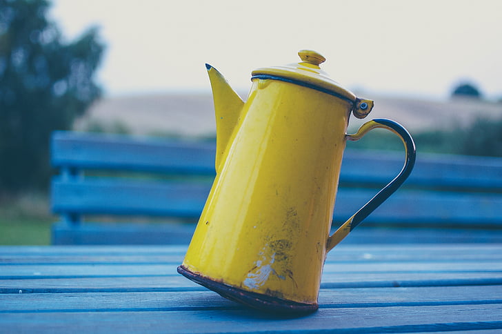 yellow, metal, covered, pitcher, grey, table, bench