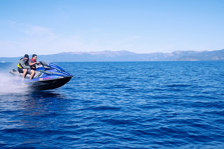 two, person, riding, blue, personal, watercraft, sea