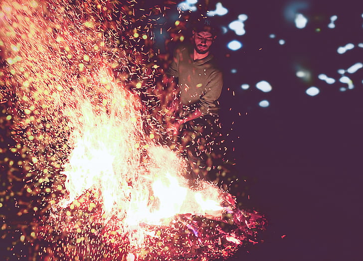 person, wearing, red, sweater, fire, star, night light