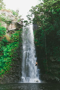 man, wearing, black, shorts, diving, waterfalls, daytime