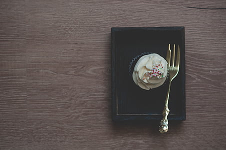 cupcake, tray, near, silver, fork, wooden table, plate