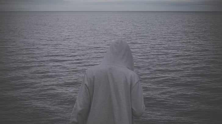 person, wearing, white, hoodie, near, body, water