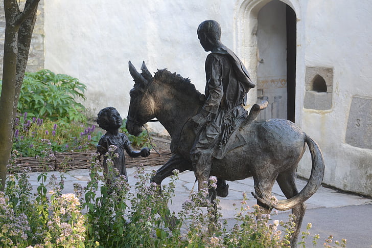glastonbury, glastonbury abbey, statue, great britain, england, man on donkey