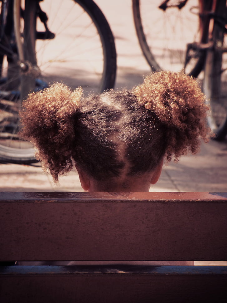 girl, pigtails, afro hair, bank, bicycles, urban scene, diversity