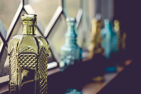 yellow, blue, glass, bottles, near, window, bar