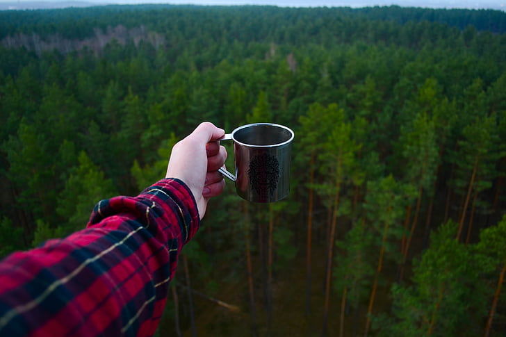 person, holding, stainless, steel, cup, front, forest