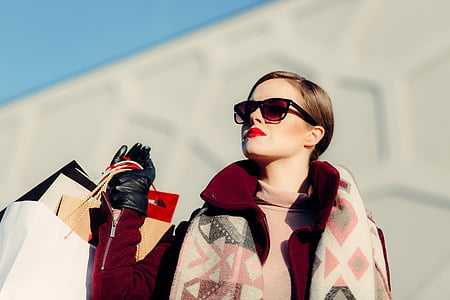 woman, red, long, coat, holding, shop, bag