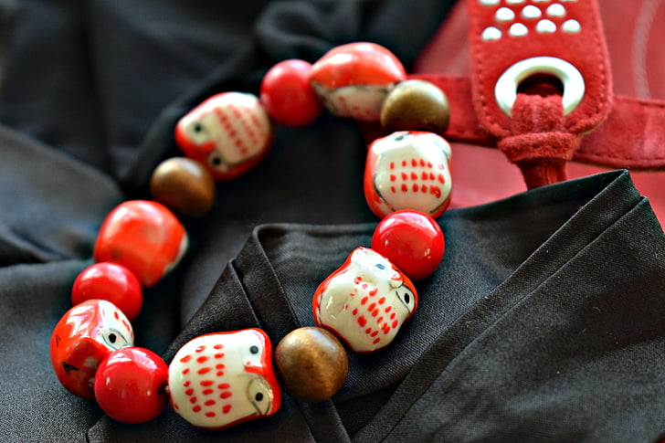 bracelet, jewelry, red and black, close up, macro, noctuidae, pearls