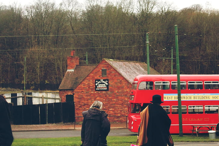 action, adult, barn, brick wall, bus, daylight, double-decker bus