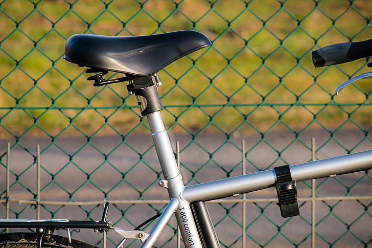 bike, saddle, bicycle saddle, frame, wheel, touring bike, fence